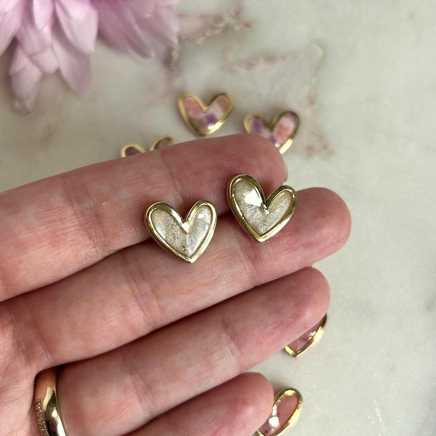 Gold framed heart marble studs