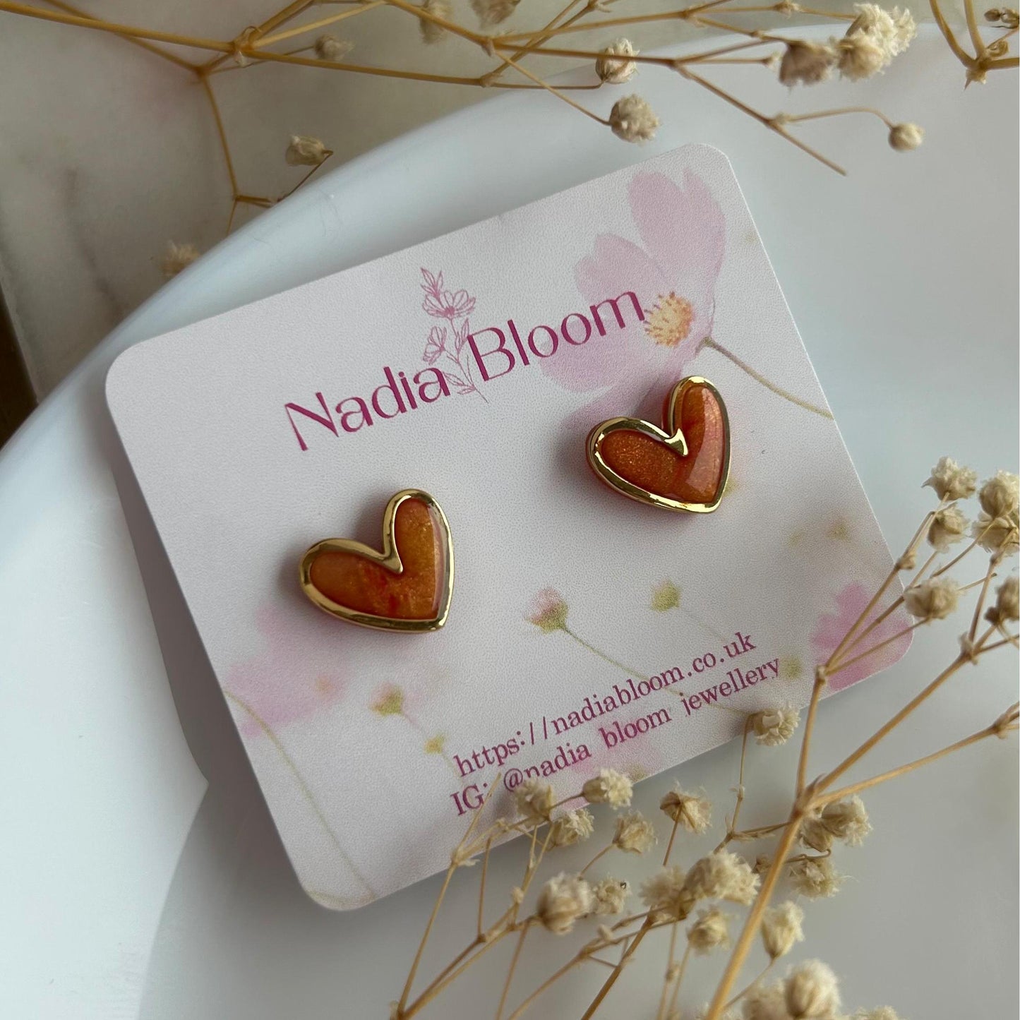 Gold framed heart marble studs