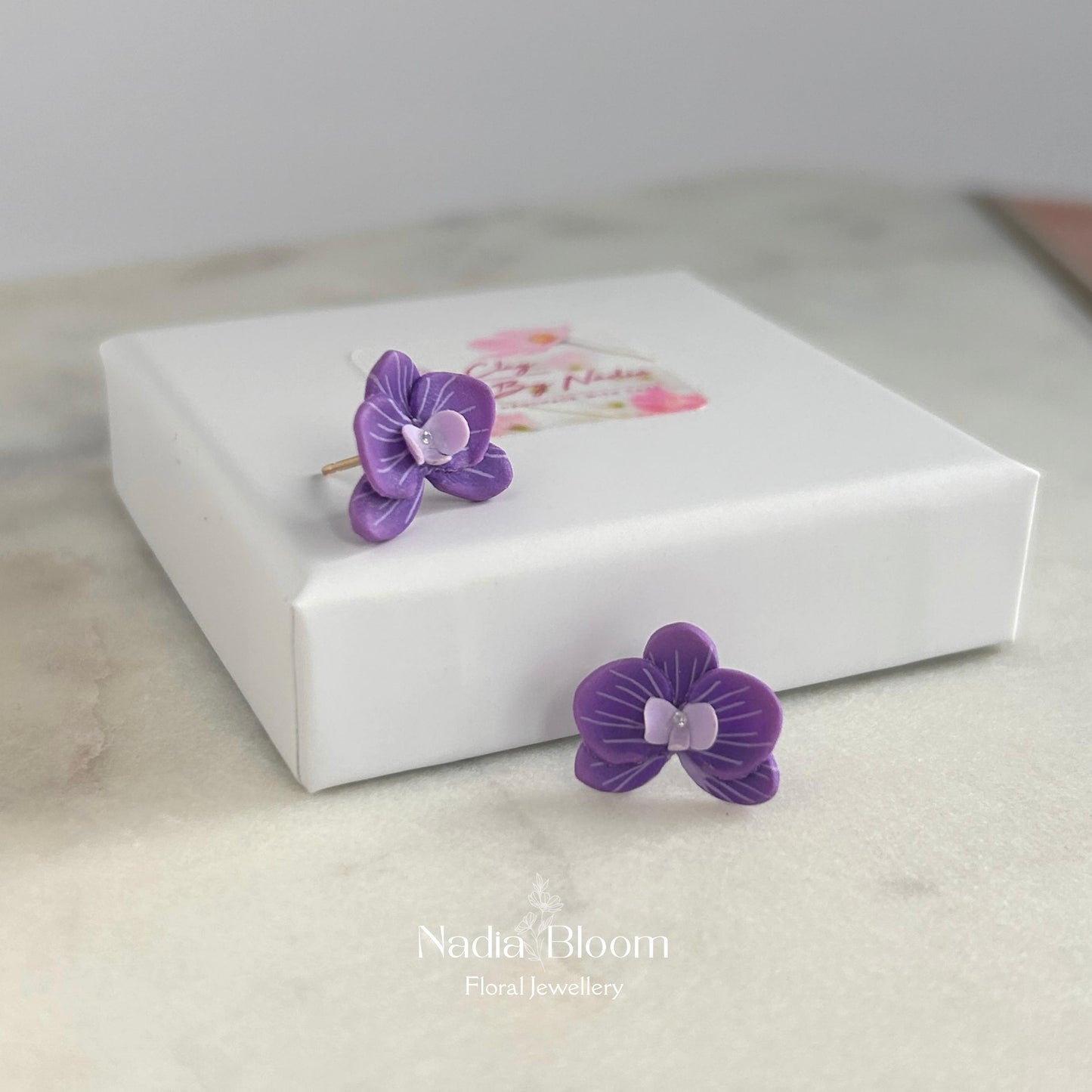 Orchid studs in purple