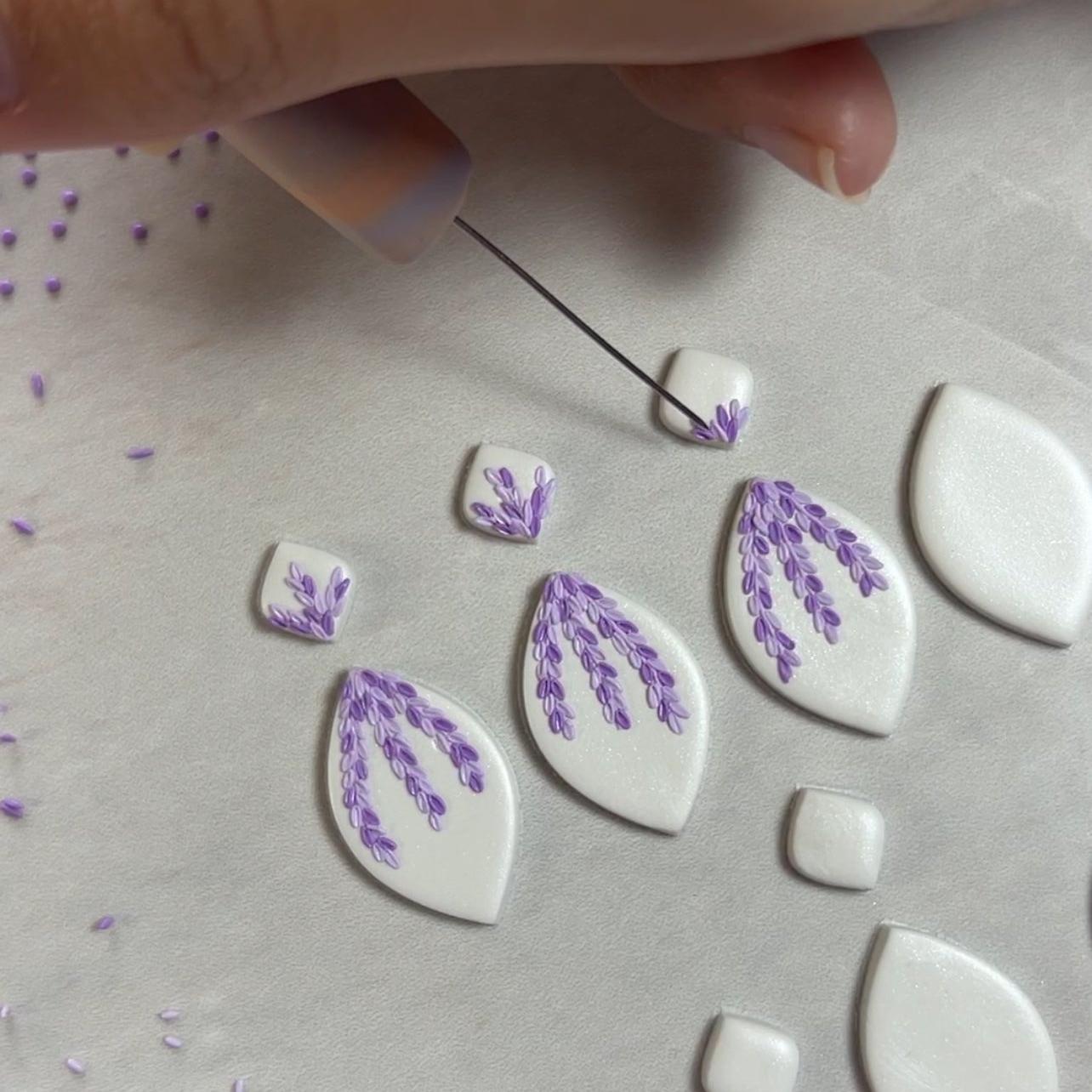 Tiny pink and purple leaves dangles