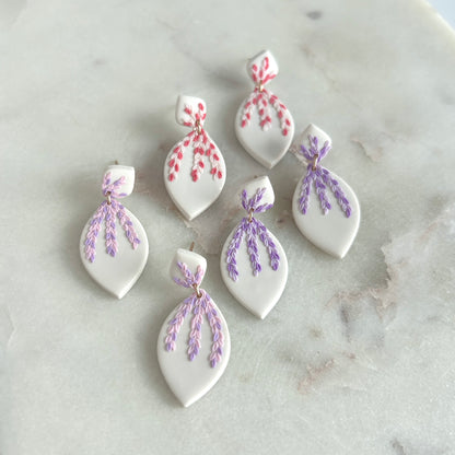 Tiny pink and purple leaves dangles