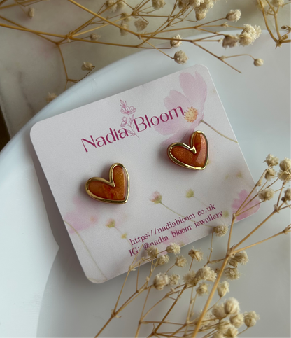 Gold framed heart marble studs