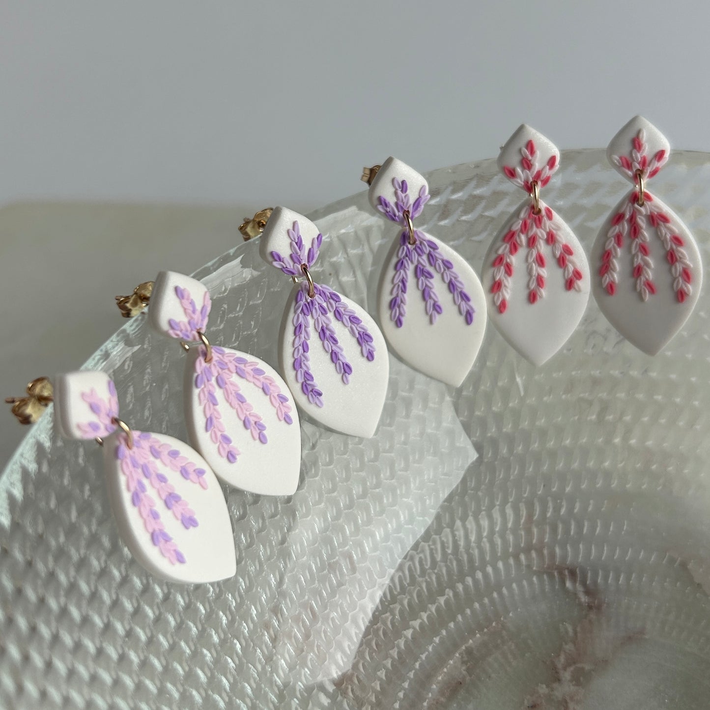 Tiny pink and purple leaves dangles