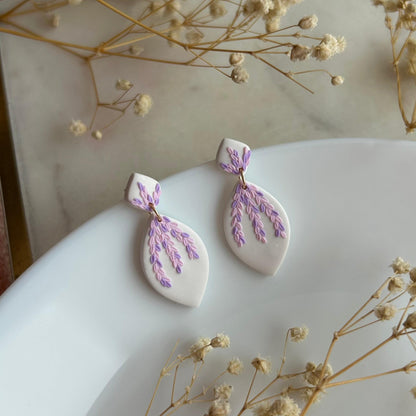 Tiny pink and purple leaves dangles