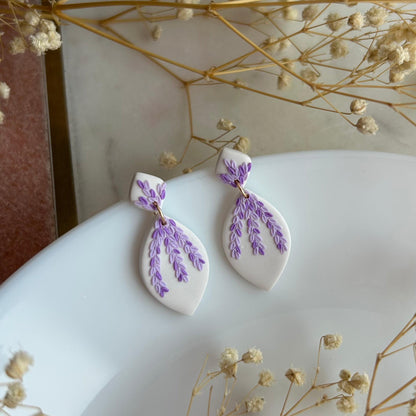 Tiny pink and purple leaves dangles