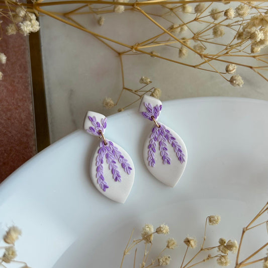 Tiny pink and purple leaves dangles