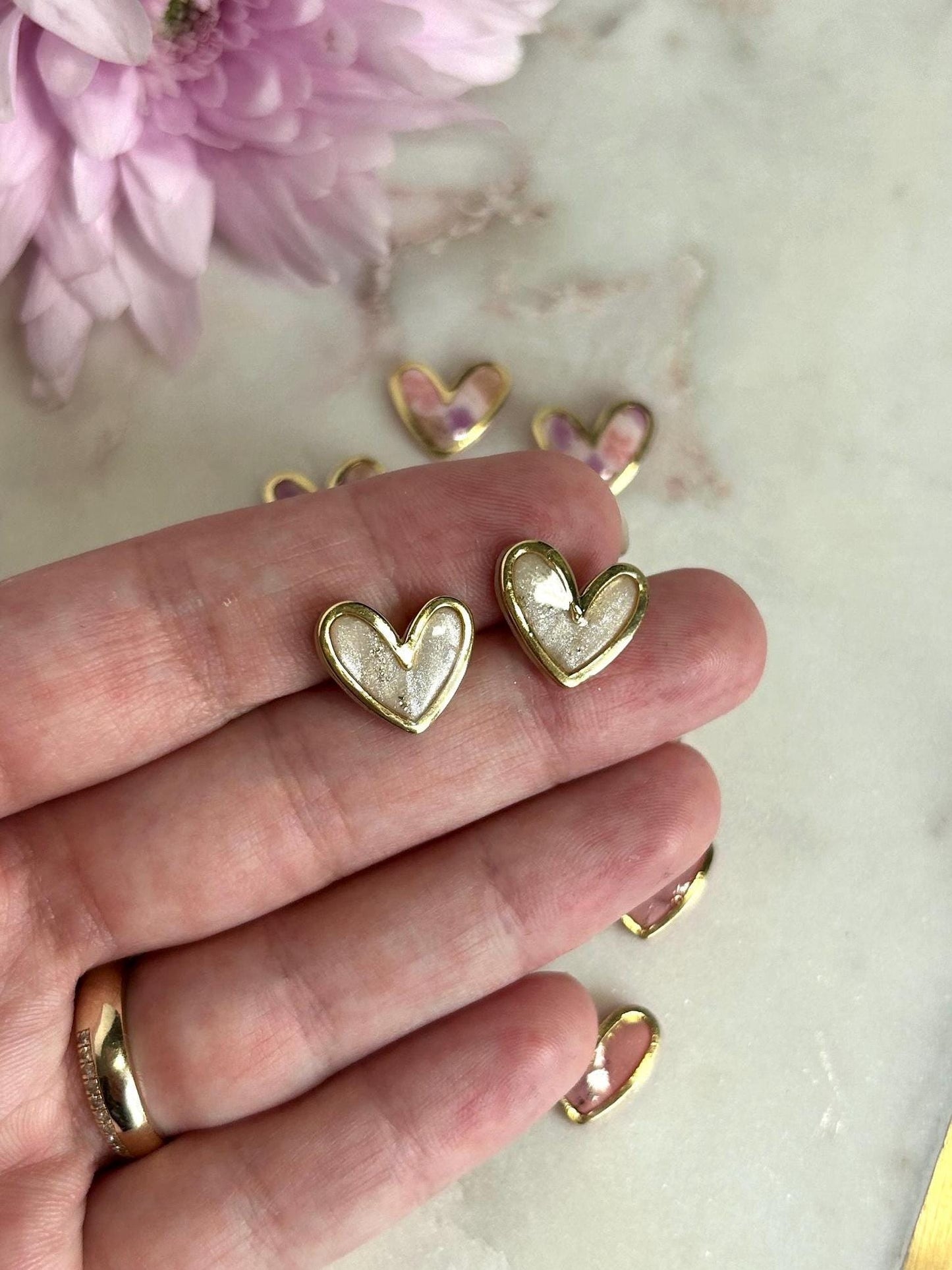 Gold framed heart marble studs